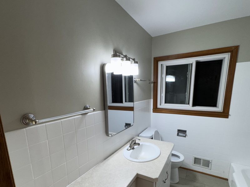Completed bathroom with vanity