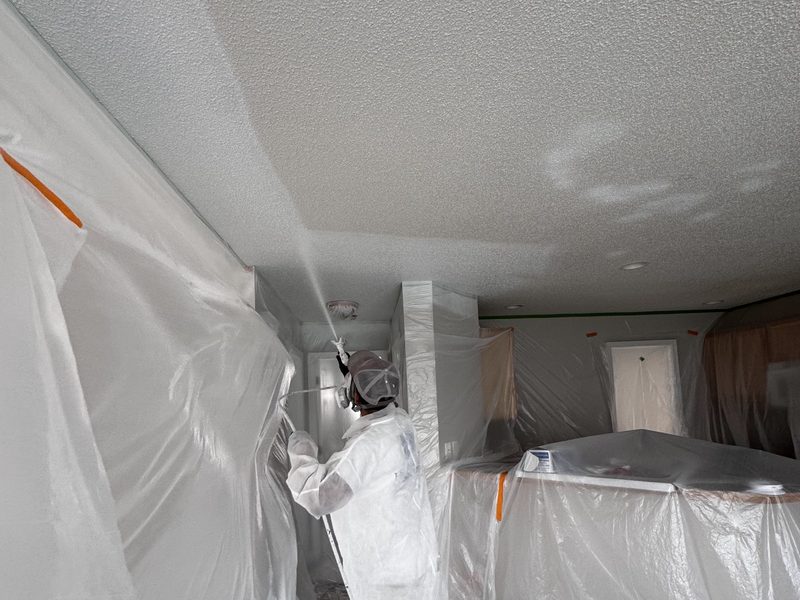 Ceiling sprayed in a masked room