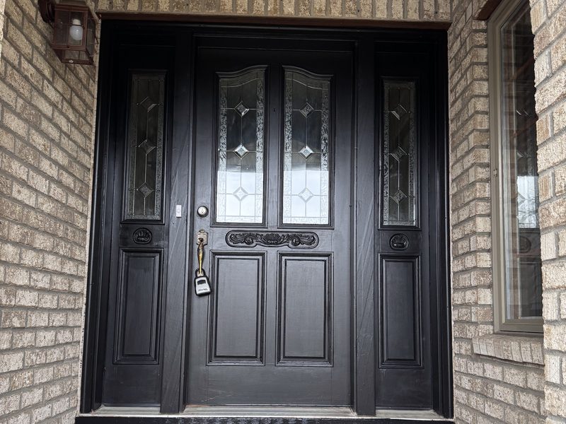 Painted front entry doors with brick surround